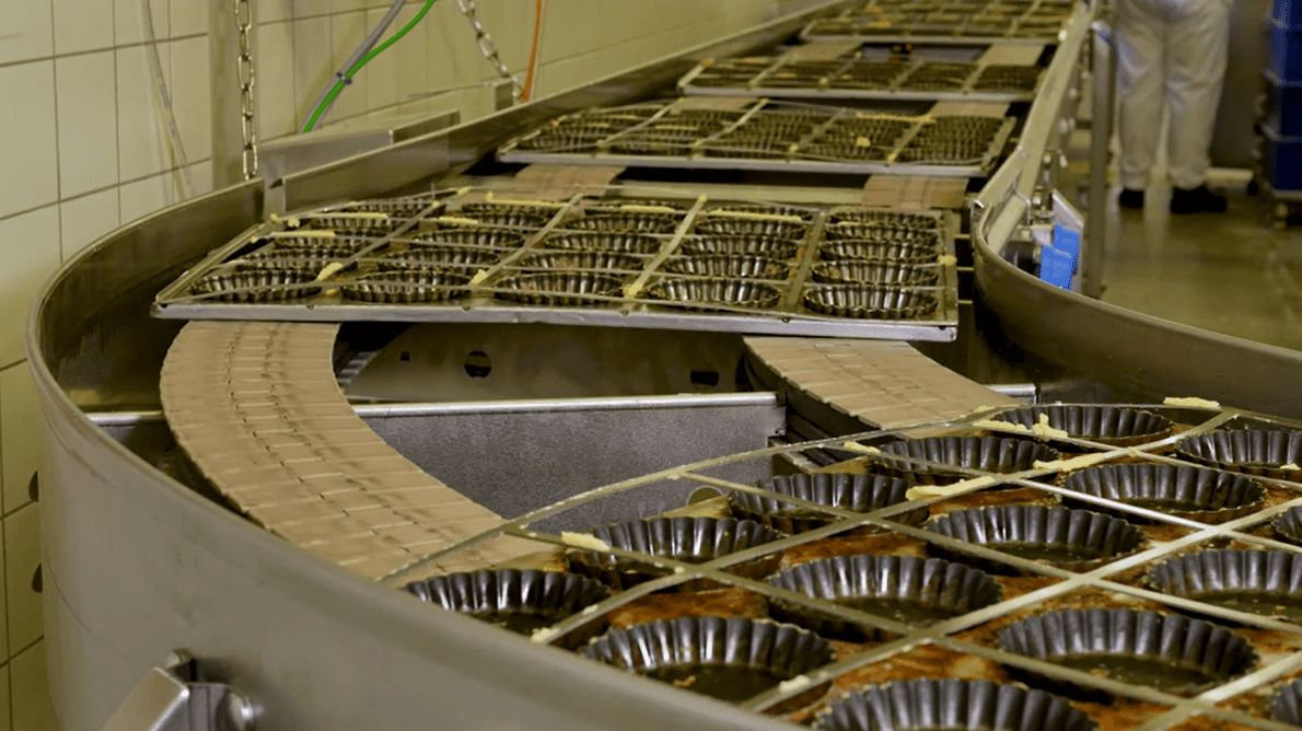 Conveyor system running on a factory production floor