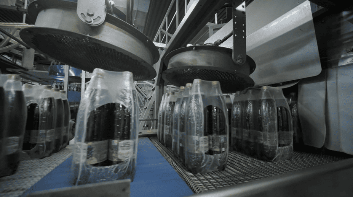 Conveyor connecting multiple production stages in a factory